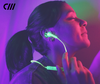 The Best Tech Accessories for Spring 2019 | Woman listening to music through Candywirez Neon Jelly Series Wireless Earbuds